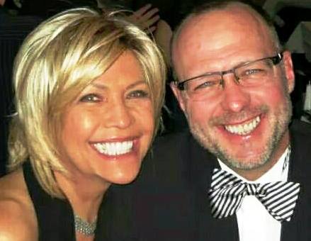 Cheri and a loved one in a bow tie, dressed up and smiling